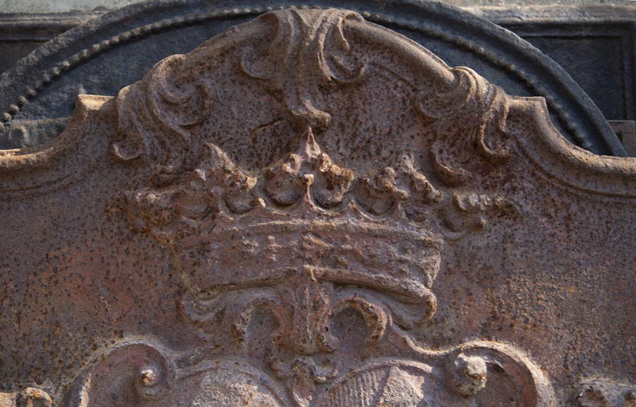 An old 18th century fireback with coat of arms and sitting lions-1