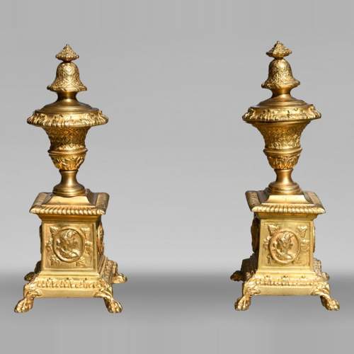 Pair of Louis XIV style gilt-bronze chenets decorated with profiles.