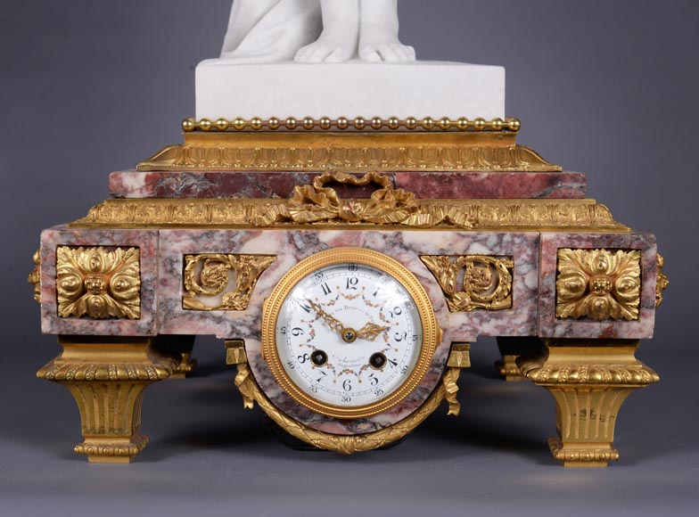 Peach blossom marble and gilt bronze clock surmounted by a statuary white marble   sculpture representing Phryne in front of his judges signed 