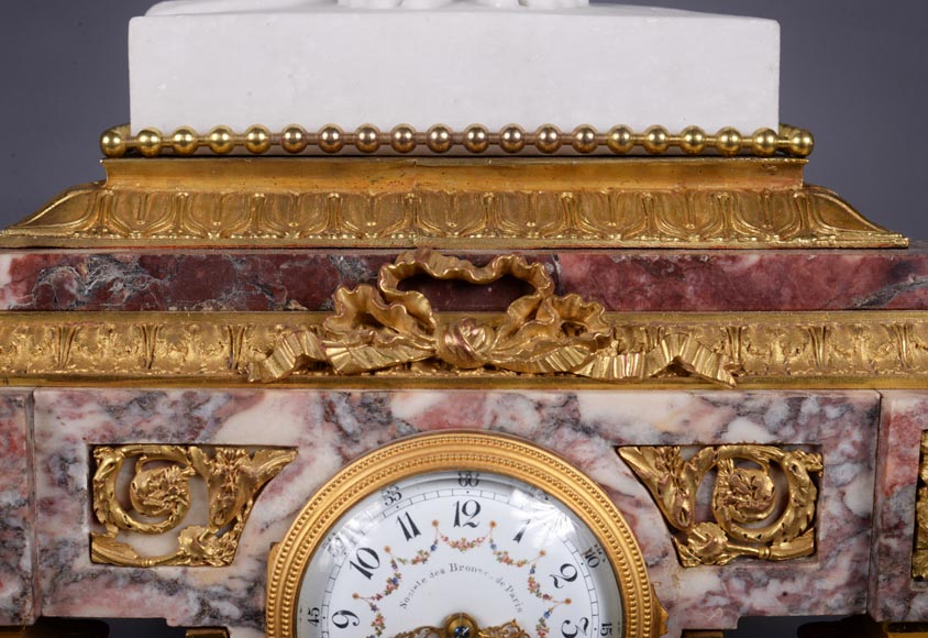 Peach blossom marble and gilt bronze clock surmounted by a statuary white marble   sculpture representing Phryne in front of his judges signed 