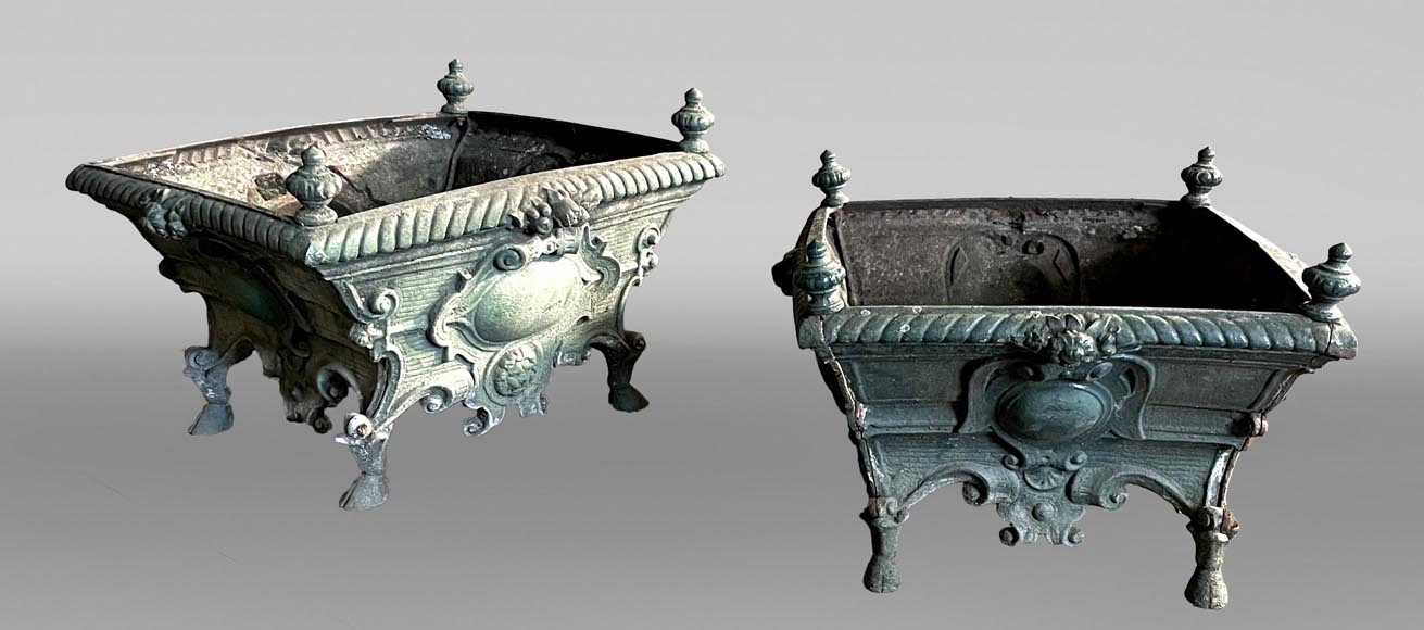 Pair of cast iron planters decorated with cartouches and lion heads-0