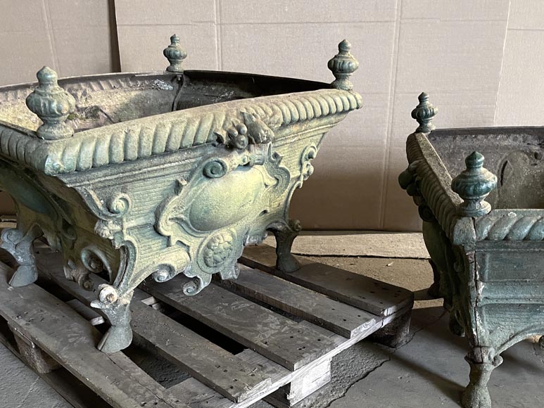 Pair of cast iron planters decorated with cartouches and lion heads-1