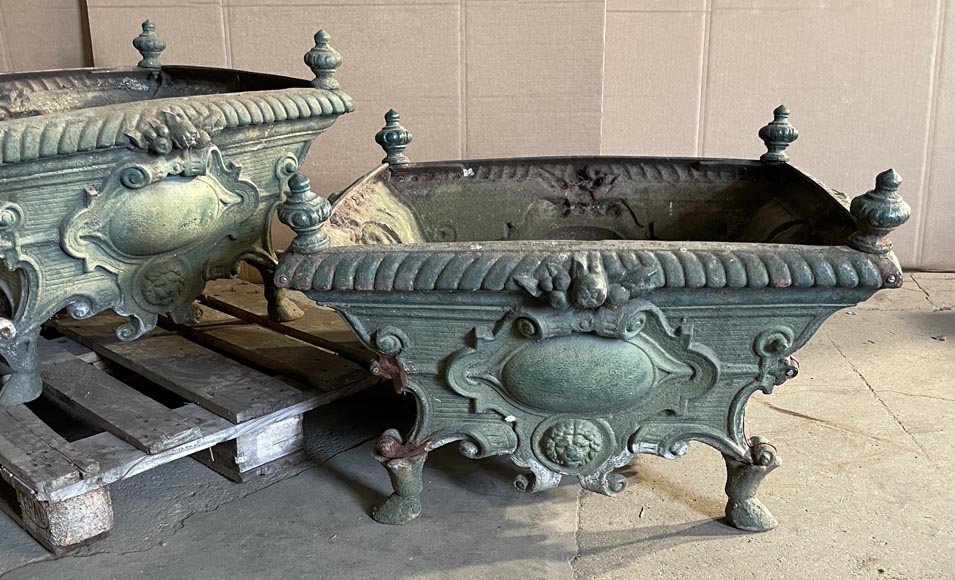 Pair of cast iron planters decorated with cartouches and lion heads-2