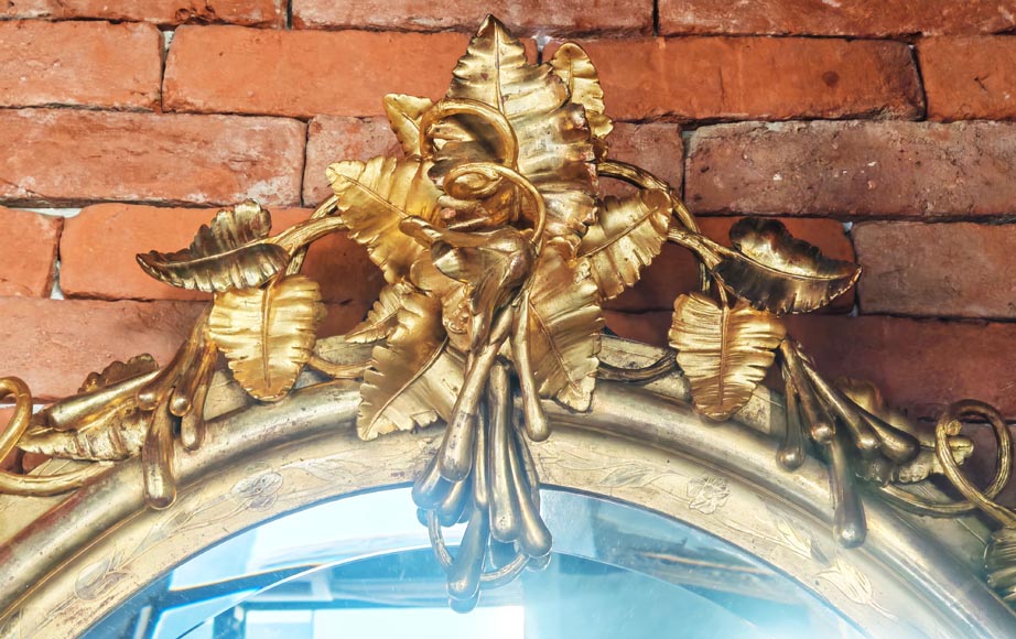 Oval gilt mirror in the Napoleon III style, featuring rich foliate ornamentation-1