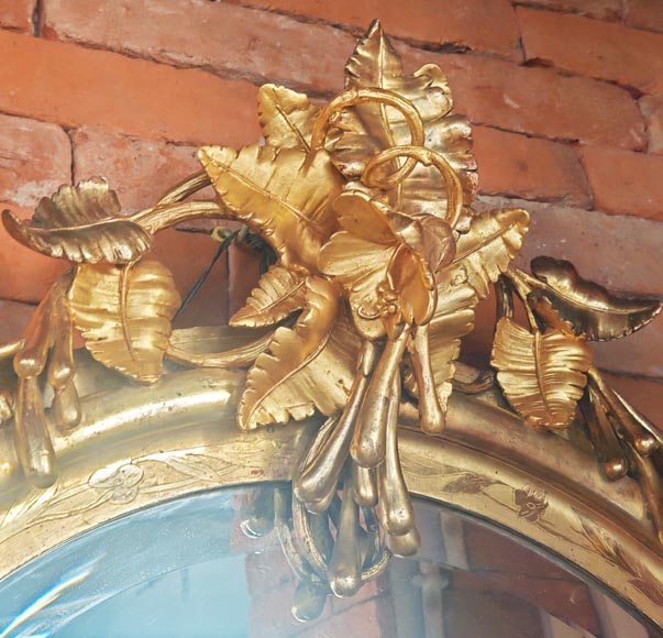 Oval gilt mirror in the Napoleon III style, featuring rich foliate ornamentation-2