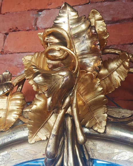 Oval gilt mirror in the Napoleon III style, featuring rich foliate ornamentation-3