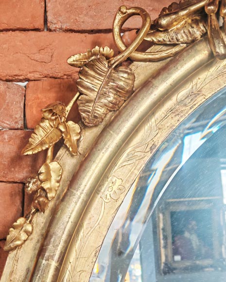 Oval gilt mirror in the Napoleon III style, featuring rich foliate ornamentation-5