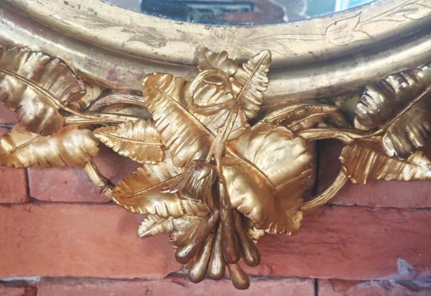 Oval gilt mirror in the Napoleon III style, featuring rich foliate ornamentation-9