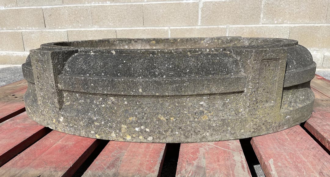 Round stone planter adorned with four projections-1