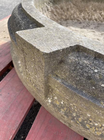 Round stone planter adorned with four projections-4