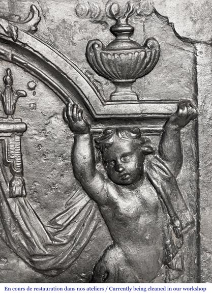 18th-century fireplace plaque with a salamander and two atlantes supporting an entablature with fire vases-9