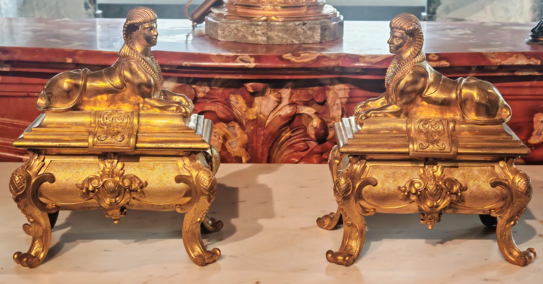 Pair of Napoleon III style gilt-bronze chenets featuring sphinxes-1
