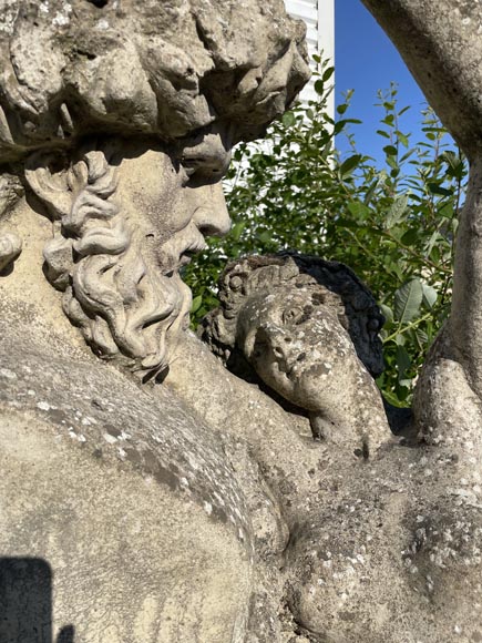 Composite stone garden statue of a woman paying tribute to Baccus, circa 1900-1