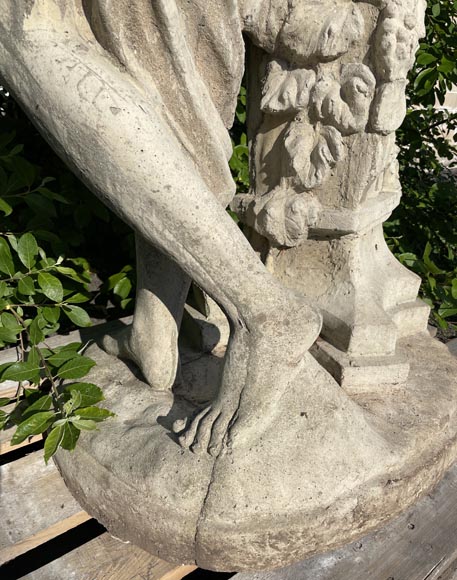 Composite stone garden statue of a woman paying tribute to Baccus, circa 1900-5