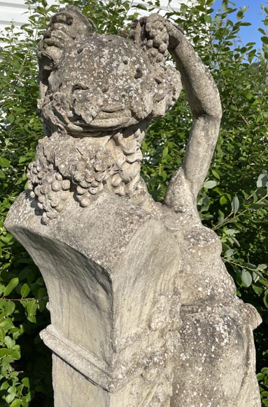 Composite stone garden statue of a woman paying tribute to Baccus, circa 1900-12