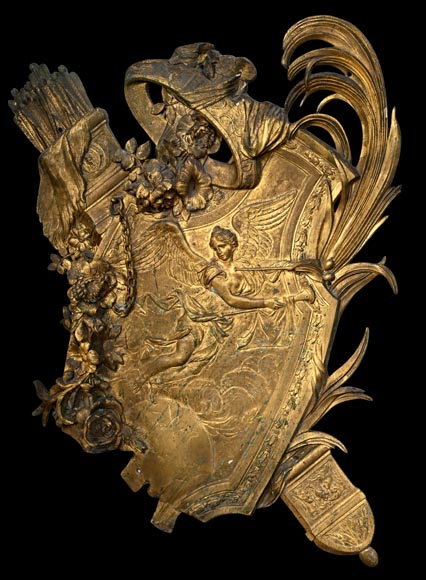 Union Centrale des Arts Décoratifs, decorative gilded bronze plaque in the form of a shield, featuring Winged Victory and trophies of arms-1
