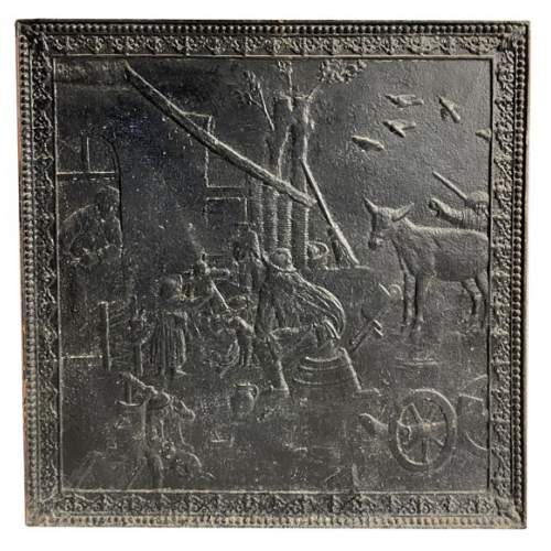 Fireback with peasant scene décor