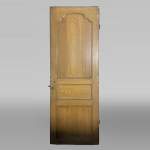 Molded door in resinous wood, painted in oak imitation