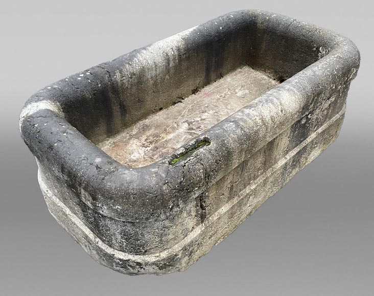 A large antique carved stone watering trough-0