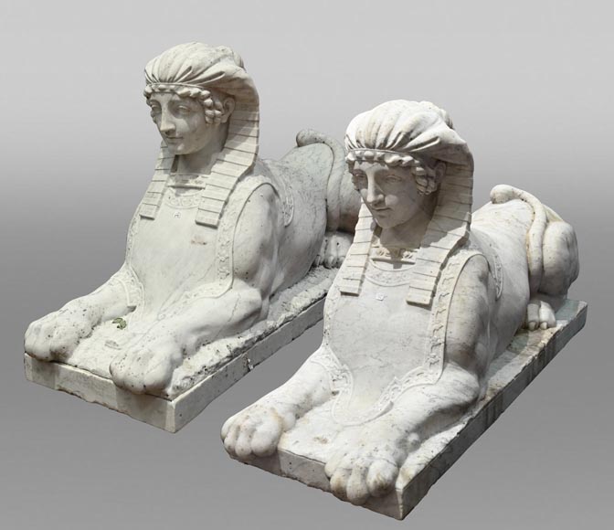 Pair of carved Carrara marble sphinxes-0