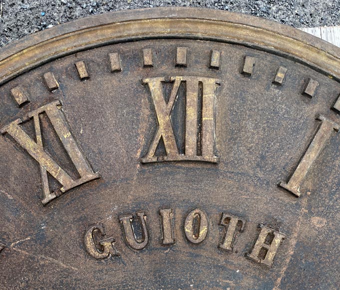 Large cast iron public clock face, with raised Roman numerals, signed 
