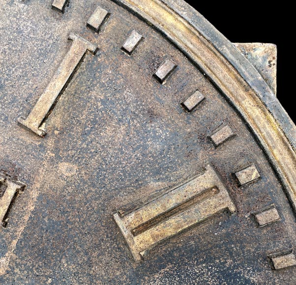 Large cast iron public clock face, with raised Roman numerals, signed 