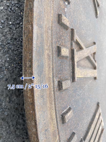Large cast iron public clock face, with raised Roman numerals, signed 
