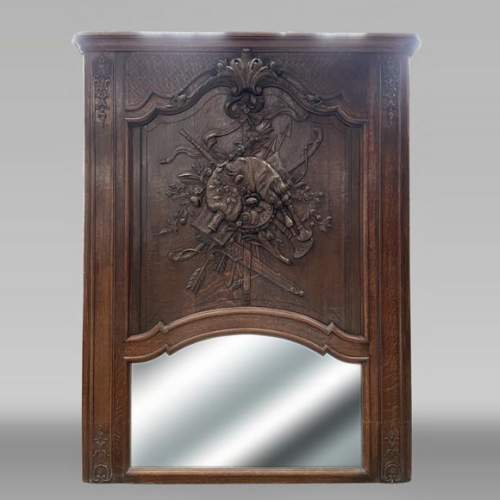 Carved and painted wooden overmantel mirror with a pastoral music trophy, in the Louis XV style, 19th century