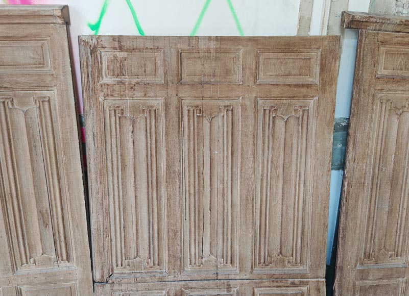 Neo-Gothic style oak wainscoting featuring a 