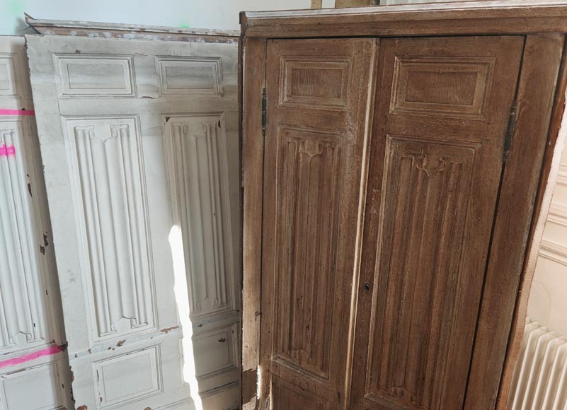 Neo-Gothic style oak wainscoting featuring a 