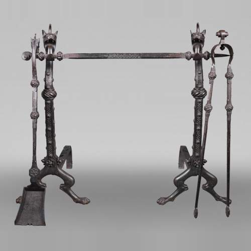 E. LARCHEVÊQUE, pair of wrought iron fire dogs with dragon heads