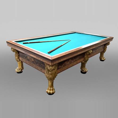 PORET AND PANNETIER, French billiard table in the Louis-Philippe style with rich marquetry decoration, resting on six gilt bronze lion's feet