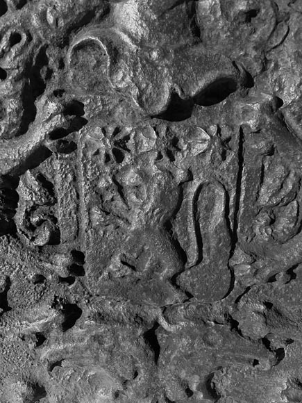 A semicircular cast iron fireplace plaque, decorated with a coat of arms, surmounted by a helmet and framed by lions. A semicircular cast iron fireplace plaque, decorated with a coat of arms, surmounted by a helmet and framed by lions.-4