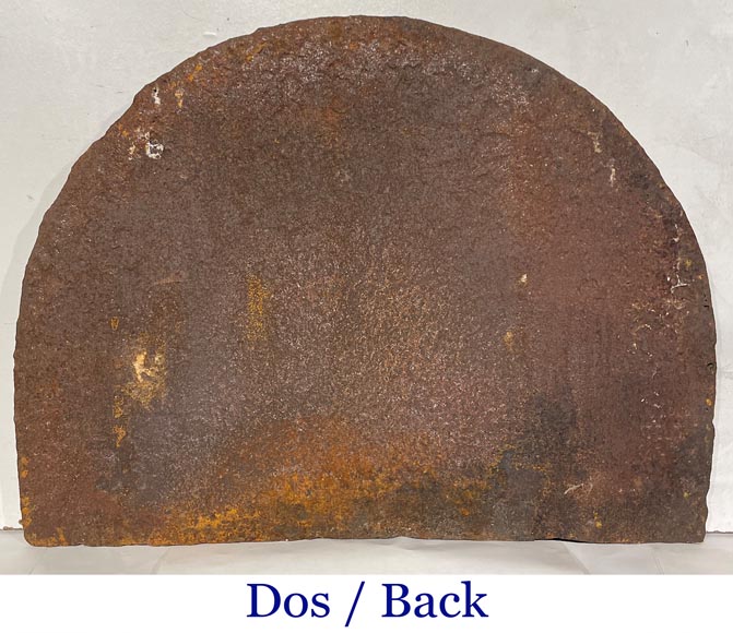 A semicircular cast iron fireplace plaque, decorated with a coat of arms, surmounted by a helmet and framed by lions. A semicircular cast iron fireplace plaque, decorated with a coat of arms, surmounted by a helmet and framed by lions.-6