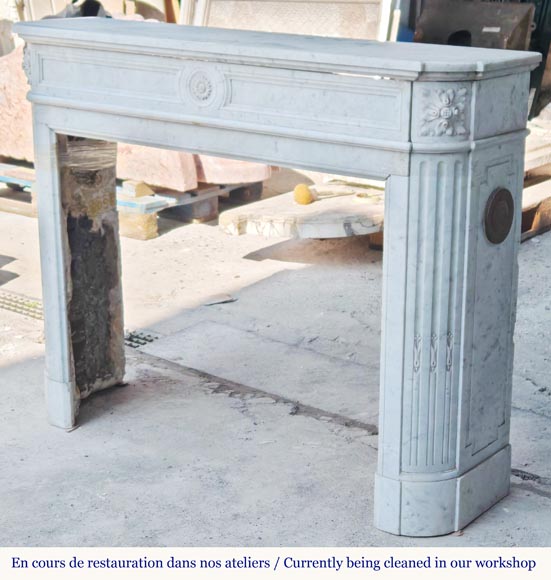 Louis XVI style Carrara marble mantel with rounded corners adorned with a sunflower flower-6