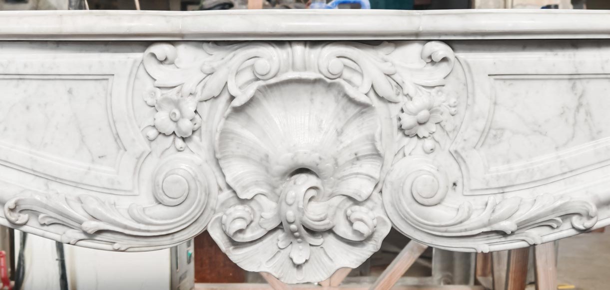 Louis XV style fireplace in Carrara marble, richly decorated with shells and flowers-1