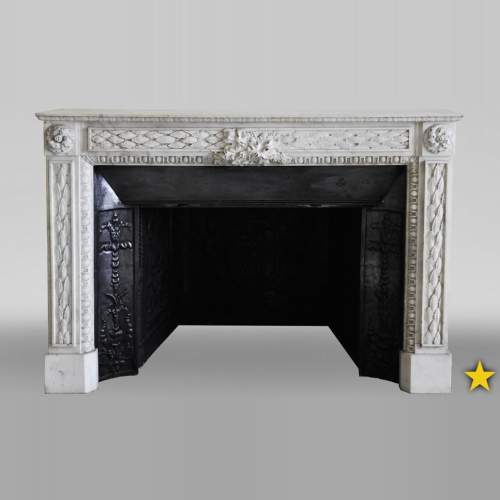 Antique Louis XVI period fireplace in Carrara marble decorated with grapevines and grapes
