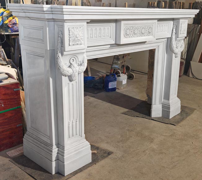 Large Louis XVI style Carrara marble fireplace, featuring fluting and garland ornamentation-3