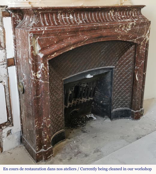 Louis XIV style mantel with an acroterion in Red of the North marble-2