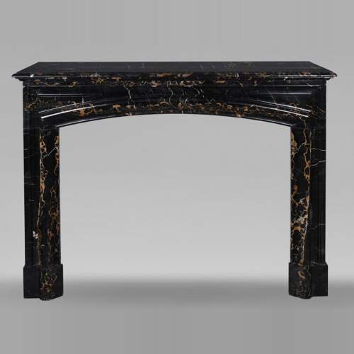 Louis XIV style fireplace in Portoro marble, with a molding and rounded frieze