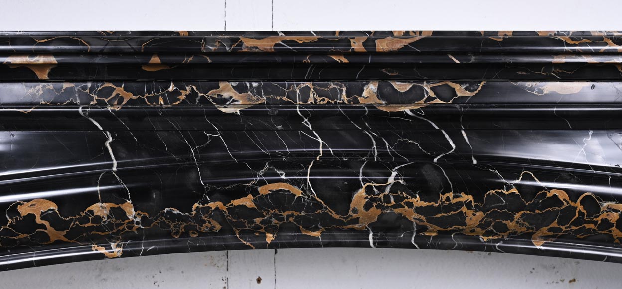 Louis XIV style fireplace in Portoro marble, with a molding and rounded frieze-1