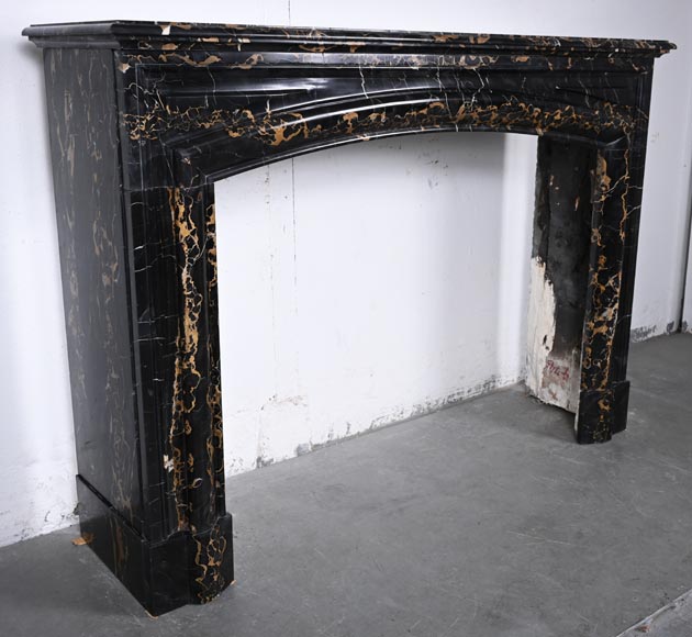 Louis XIV style fireplace in Portoro marble, with a molding and rounded frieze-2
