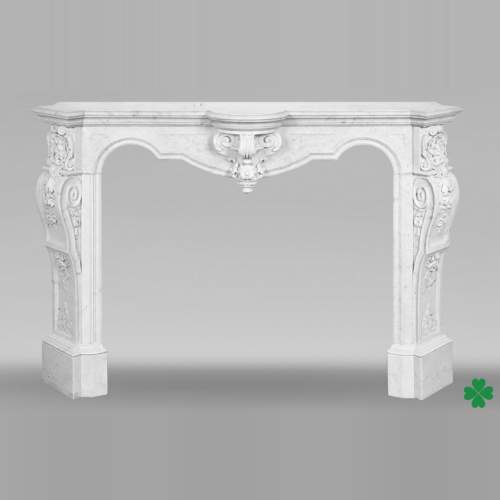 A richly sculpted Carrara marble fireplace in the Napoleon III style, decorated with a lion's head.