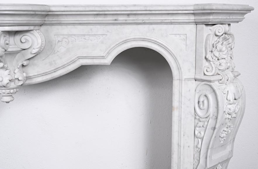 A richly sculpted Carrara marble fireplace in the Napoleon III style, decorated with a lion's head.-9