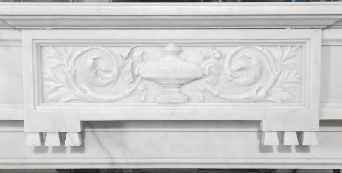 A Louis XVI style fireplace, richly decorated with garlands and vases, in Carrara marble-1