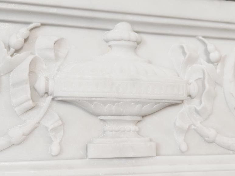 A Louis XVI style fireplace, richly decorated with garlands and vases, in Carrara marble-2