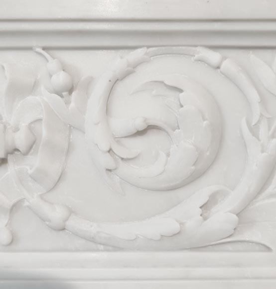 A Louis XVI style fireplace, richly decorated with garlands and vases, in Carrara marble-3