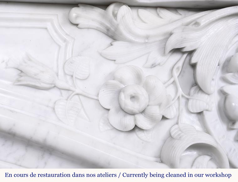 A highly sculpted Louis XV style fireplace in Carrara marble, decorated with a shell motif.-4