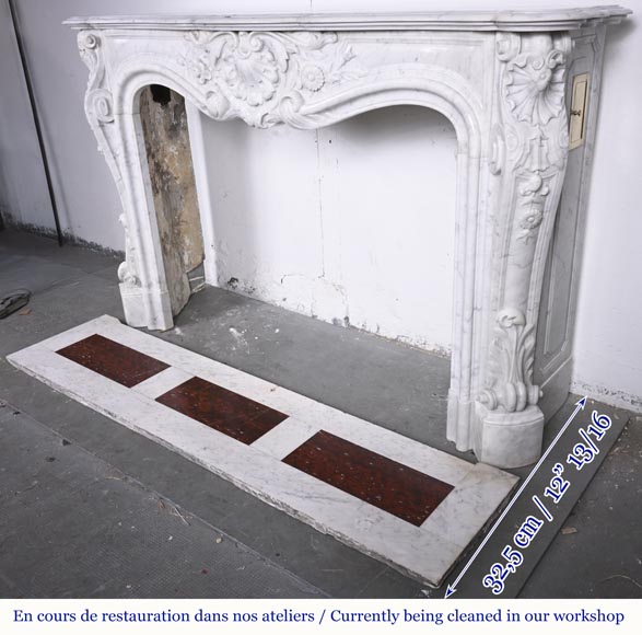 A highly sculpted Louis XV style fireplace in Carrara marble, decorated with a shell motif.-10