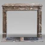 Louis XVI period mantel in Rouge Royal marble